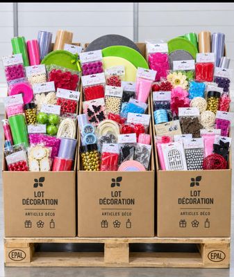 three boxes with different items in them on a pallet