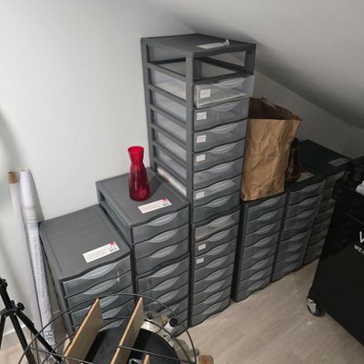 a room with a lot of boxes and a camera on the floor
