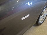 a close up of a car with a sticker on it