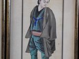 framed picture of a man in a kimono suit with a blue tie
