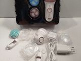 a box with a hair dryer and other items on a table