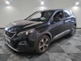 a picture of a black car parked in a garage