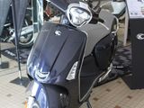 a scooter that is parked inside of a store