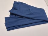 a pair of blue pants sitting on top of a white table