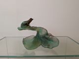 a glass table with a bird on top of it