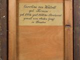 an old picture of a wooden frame with writing on it