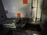 a sink and a faucet in a small kitchen