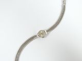 an image of a silver wrist watch with a chain around it