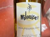 a bottle of wine that is being held by a person