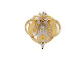 an image of a gold broochle with a clock on it