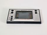 an old game console sitting on top of a white table