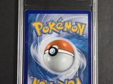 a close up of a pokemon card on a black surface