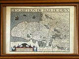 framed map of the region of cax in a wooden frame on a wall