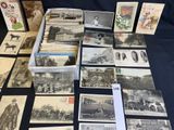 several old black and white photographs of people and animals on a table