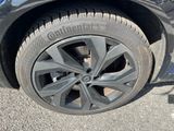 a close up of a tire on a blue car