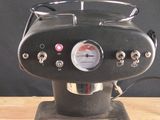 a coffee machine that is sitting on a wooden table