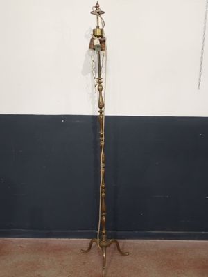 brass plated floor lamp with a star on the top of it