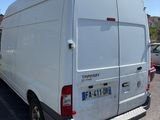 a white van that is parked in a parking lot