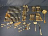 many different types of silverware on the table