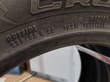 a close up of a tire on a shelf in a garage