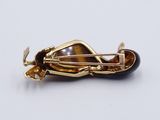 gold plated broochle with tiger eye stone and black onyx