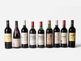 a group of six bottles of wine sitting next to each other
