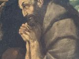 an image of a painting of a man sitting in front of a crucifix