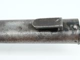 close up of a metal pipe with a metal handle on a white background