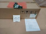 a cardboard box with a small electronic device inside of it
