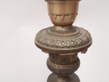 a candle that is sitting on top of a wooden pole