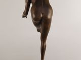 an image of a bronze statue of a woman on a pedestal