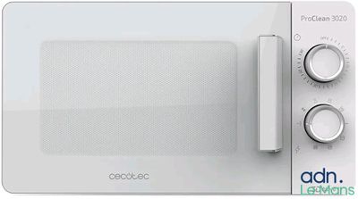 une photo d'un four à micro-ondes blanc dont la porte est ouverte