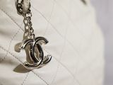 a chanel bag with a chain hanging from it
