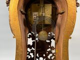 a wooden clock that is sitting on a table