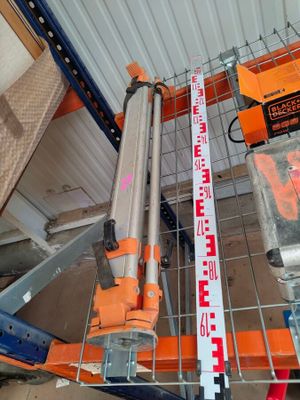 many different types of tools on a shelf in a warehouse