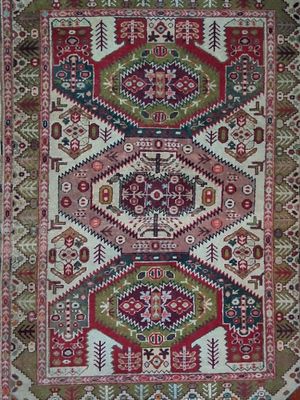 a red and green rug with a pattern on it