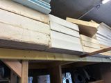 many stacks of wood stacked on top of each other
