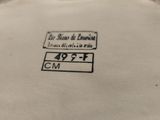 an image of a close up of a plate with a sign on it