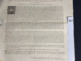 an old document with a piece of paper on top of it