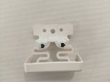 a small white object on a white surface