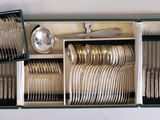 a picture of a set of silverware in a box