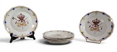 three plates with designs on them sitting on a table