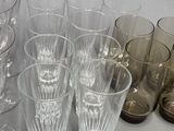 a lot of glasses that are sitting on a table
