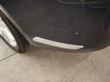 a close up of a car door with the door handle missing