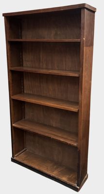 a large wooden bookcase with four shelves on top of it
