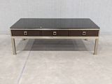 a coffee table with two drawers and a glass top
