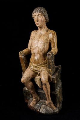 an image of a statue of a man sitting on a chair