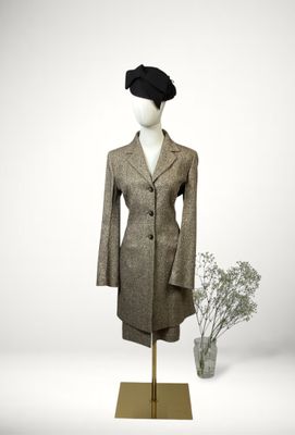 an image of a mannequin dressed in a suit and hat
