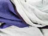 a close up of a scarf on a white surface