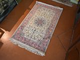 two rugs that are on the floor in a room